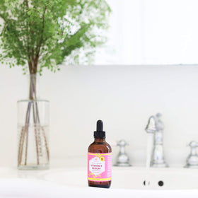 Leven Rose smoothing onto hair ends to boost shine and reduce frizz