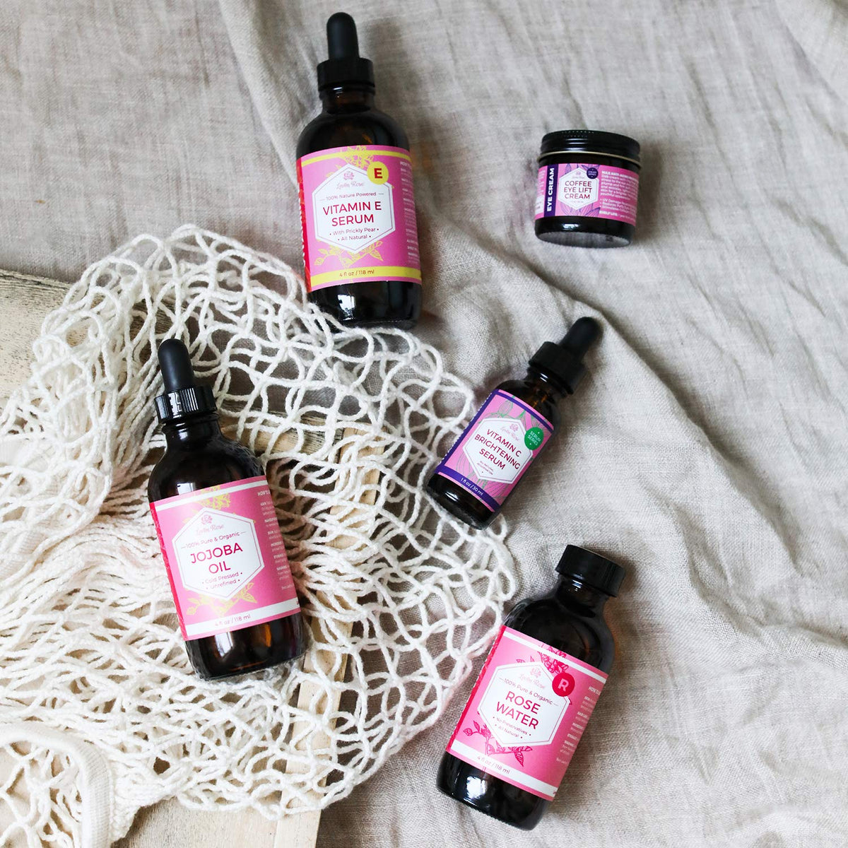 Leven Rose bottle in hand showing 4 oz scale for portability
