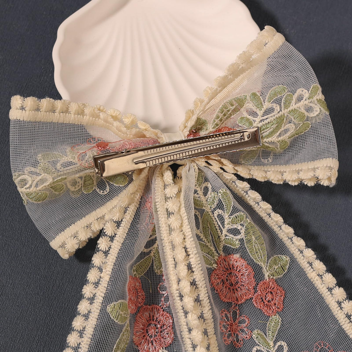 LFOUVRE fabric texture close-up showing soft lace and durable finish