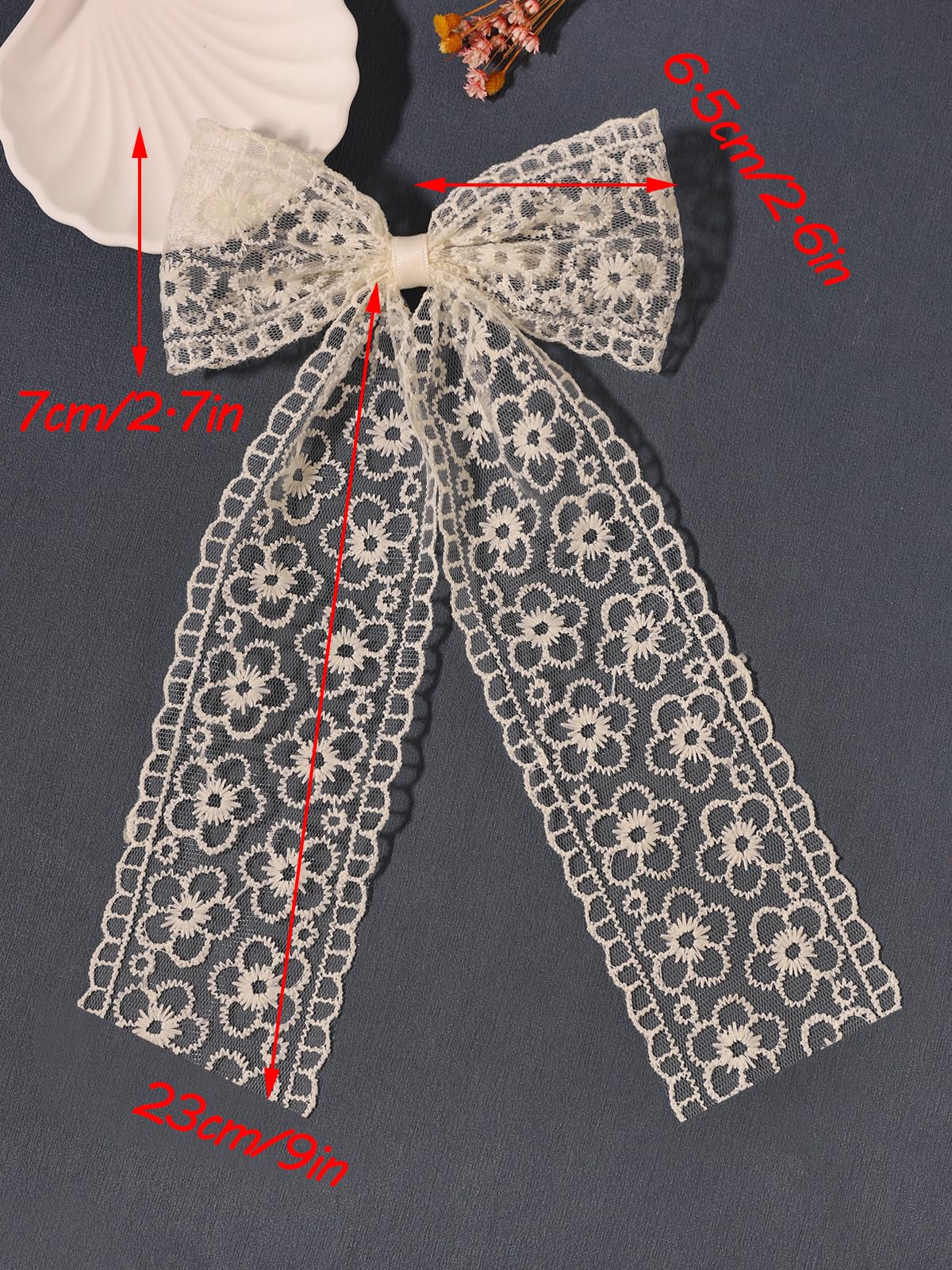 LFOUVRE bow clipped on a ponytail adding instant feminine flair