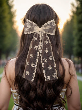 LFOUVRE close-up embroidered flowers on lace highlighting delicate detail