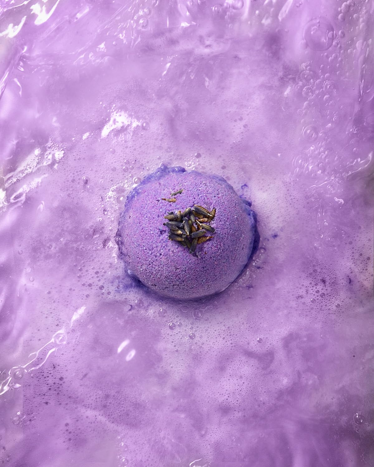 LifeAround2Angels opened bath bomb revealing color and moisturizing core for soothing soak