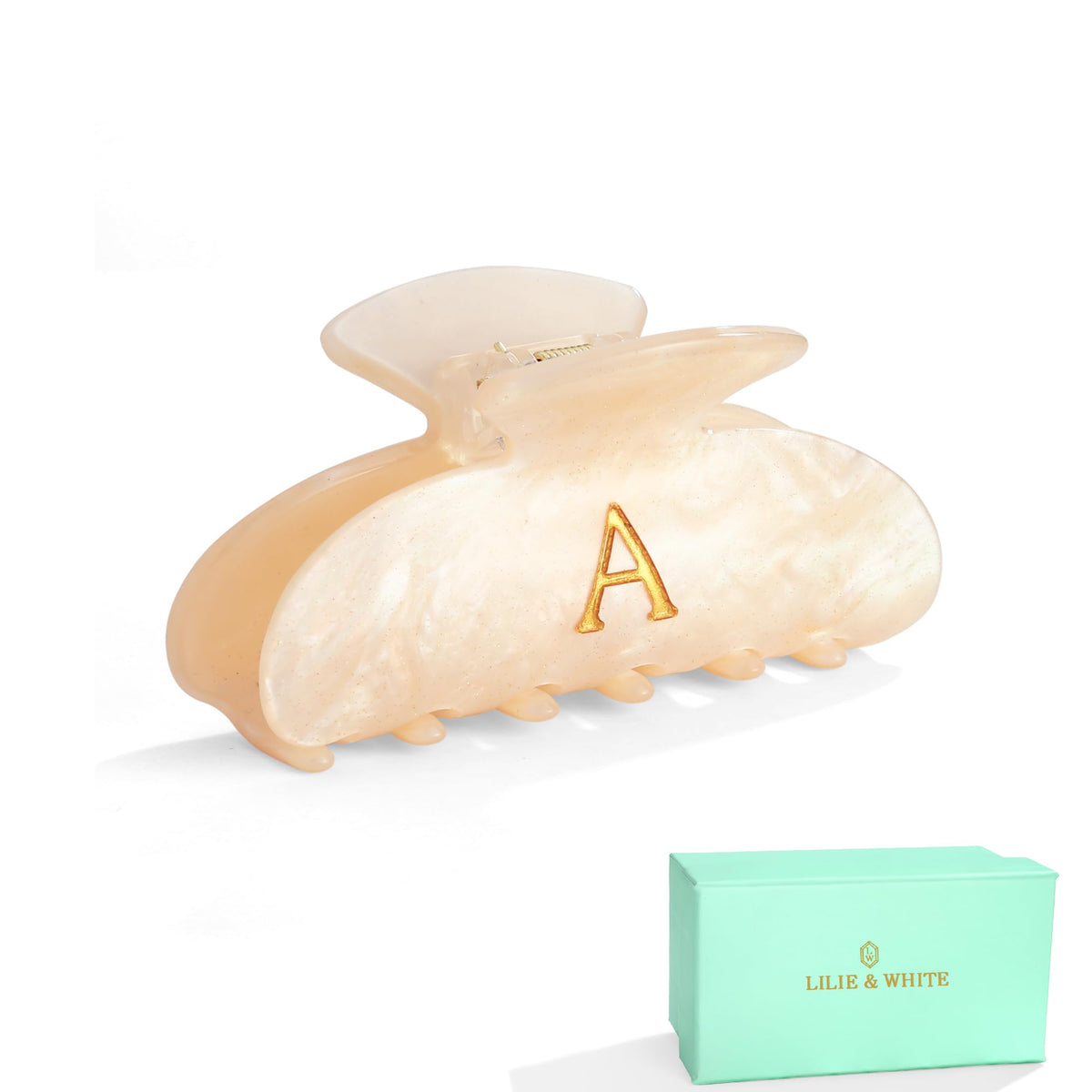 LILIE&WHITE clip front view in golden gift box shows polished presentation
