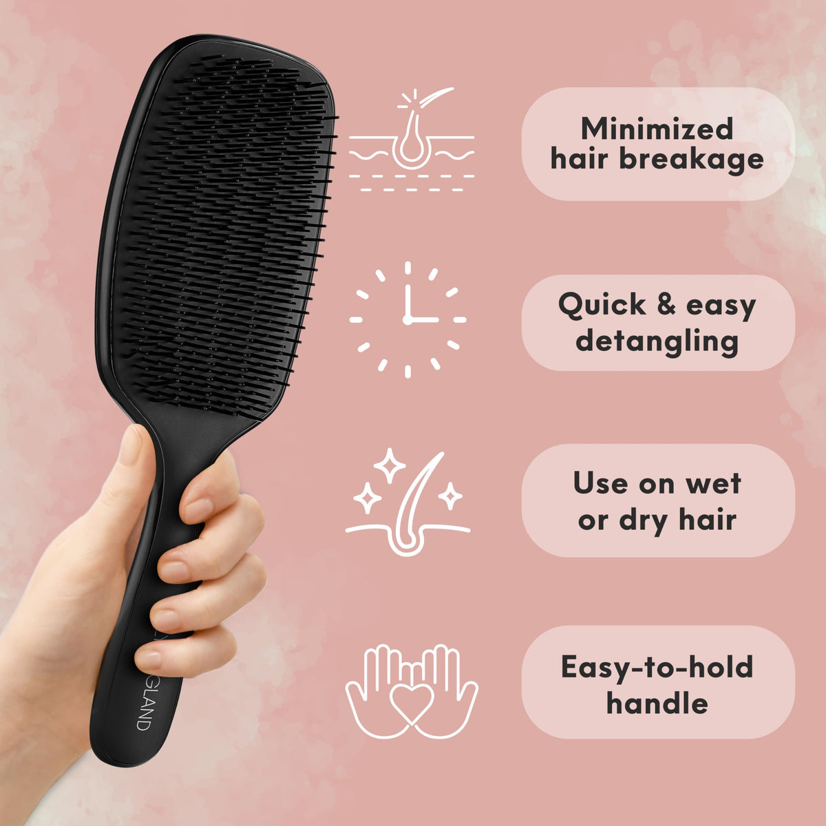 Lily England brush held in hand to show size and easy-grip design for quick detangling