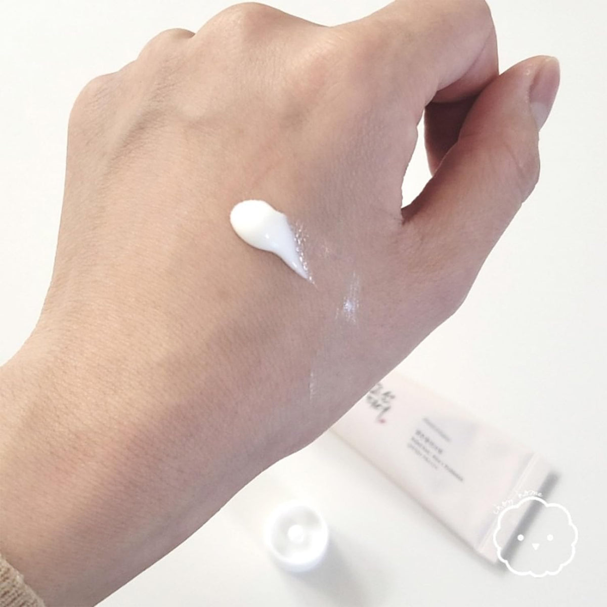 LING LI TE LLT creamy sunscreen texture on hand showing quick absorption and hydrating finish