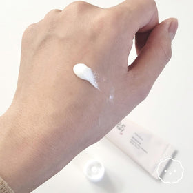 LING LI TE LLT creamy sunscreen texture on hand showing quick absorption and hydrating finish