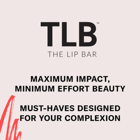 The Lip Bar trophy wife next to ruler for scale showing compact .30 fl oz size