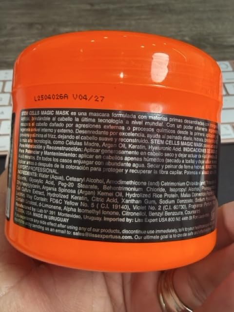 Liss Expert Professional applying treatment on shoulder-length hair for even coverage