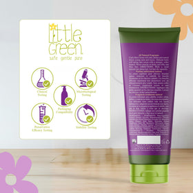 Little Green child using cream in a lifestyle scene showing comfortable styling routine
