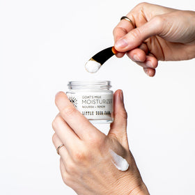 Little Seed Farm jar inside travel bag ready for on-the-go skin care