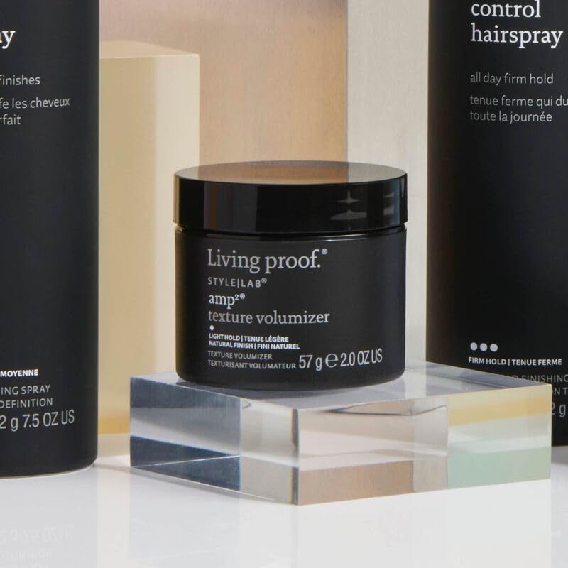 Living Proof product in use styling hair to add lift and touchable texture