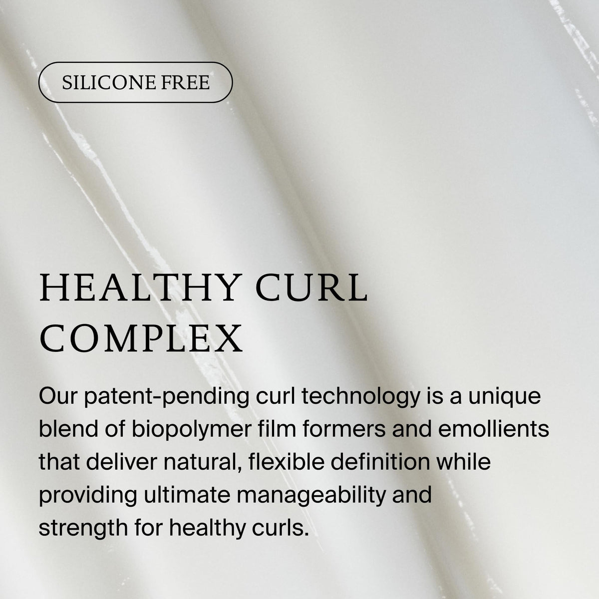 Living Proof conditioner being smoothed through hair in-shower for frizz control benefit