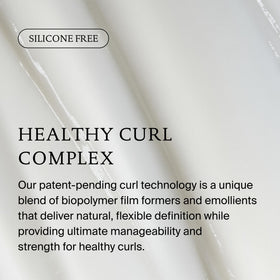 Living Proof conditioner being smoothed through hair in-shower for frizz control benefit