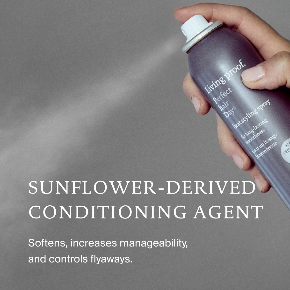 Living Proof holding bottle in hand for easy application and control