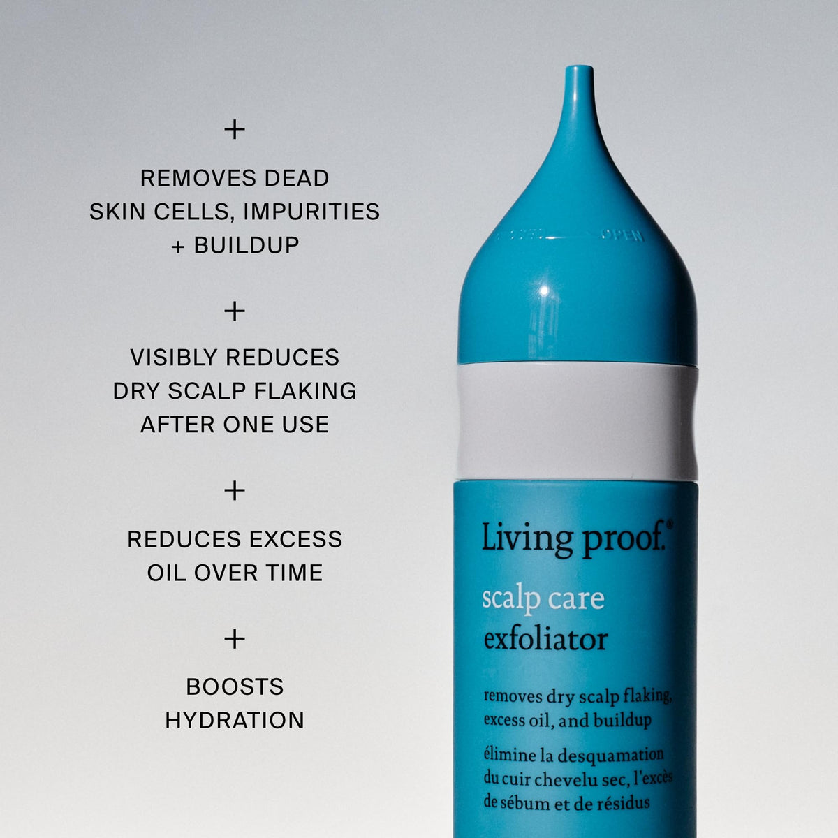 Living Proof bottle in hand for size scale and simple at-home treatment convenience