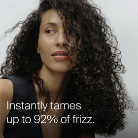 Living Proof being applied to dry hair for quick frizz control benefit