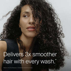Living Proof dispensing conditioner from pump, shows easy control and use