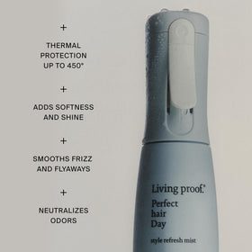 Living Proof spray in use on roots demonstrating easy application and convenience