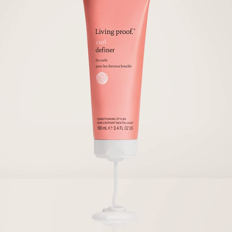 living proof styled curls in natural light showing defined, frizz-reduced benefit