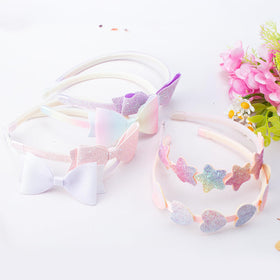 Lizioo detail of bow shape sewn on band showing decorative charm