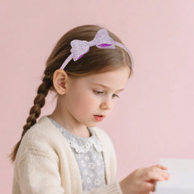 Lizioo child wearing glitter headband showing comfortable secure fit
