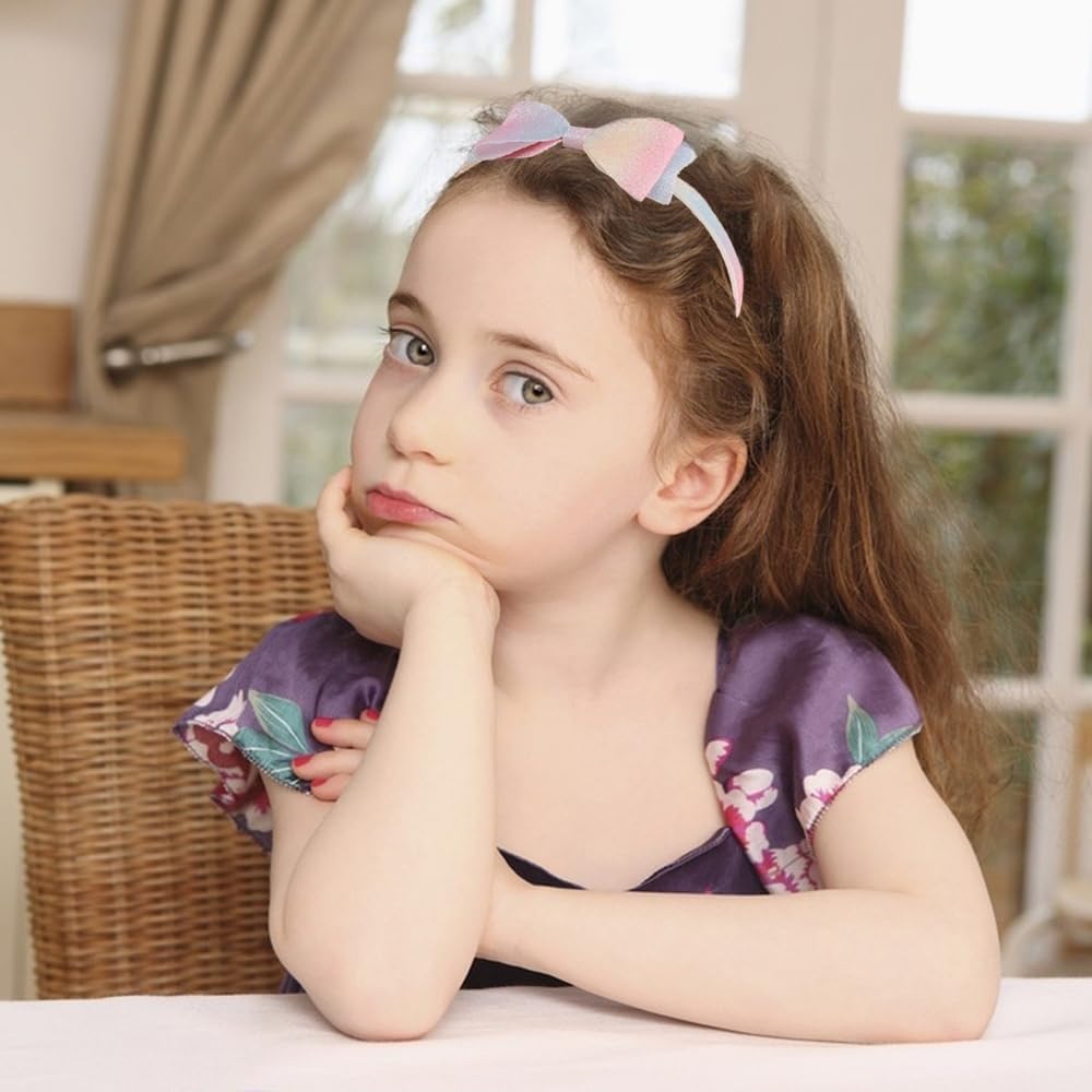 Lizioo headband beside a hand to show scale and kid-friendly size