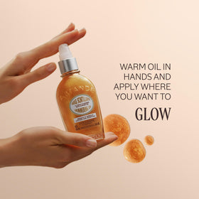 L'OCCITANE applying oil on arm for hydrated, luminous skin benefit