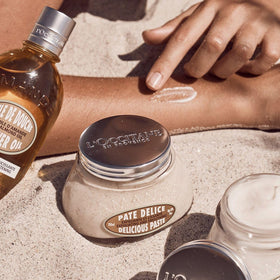 L'Occitane almond paste placed in bathroom setting illustrating at-home spa ritual and aroma