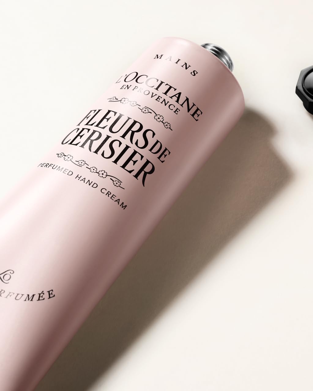 L'OCCITANE tube cap detail, demonstrates easy controlled dispensing benefit