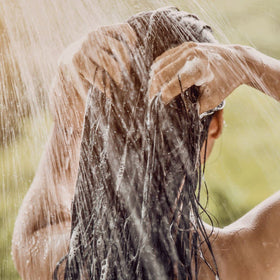 L'OCCITANE in-shower use showing hair being rinsed for refreshed scalp and shine
