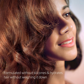 L'Occitane creamy conditioner texture demonstrating lightweight feel