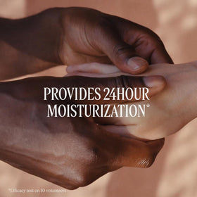 L'OCCITANE applying hand cream to palms demonstrating rapid absorption and softness