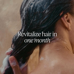 L'Occitane Intensive Repair Shampoo staged in a bathroom for nourishing routine benefit