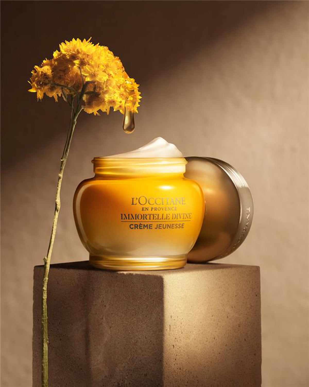 L'OCCITANE jar open revealing smooth cashmere texture for immediate hydration