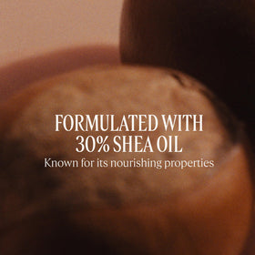 L'Occitane oil held in hand to show travel-friendly size and convenience