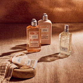 L'OCCITANE on a shower shelf styled with towels to show daily routine fit