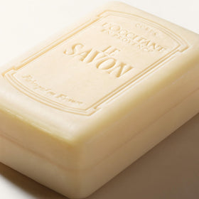 L'OCCITANE shea lavender next to a coin for scale and portion clarity