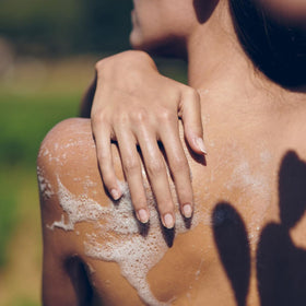 L'OCCITANE bottle in shower scene conveying refreshing use