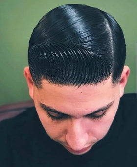 Lockhart's pomade applied on fingertips to show smooth application benefit