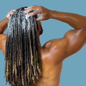 LOCssentials applied to locs in shower demonstrating cooling scalp refreshment