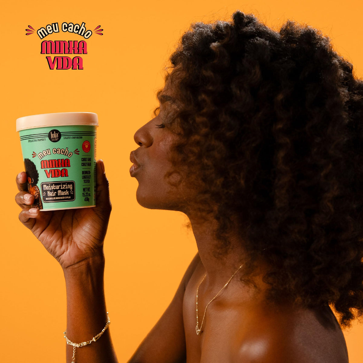 Lola being applied to wet curls for detangling and softening