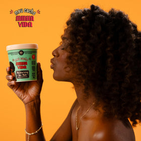 Lola being applied to wet curls for detangling and softening