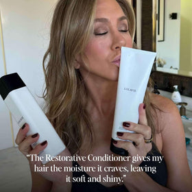 LolaVie conditioner staged on bathroom vanity conveying salon-style routine