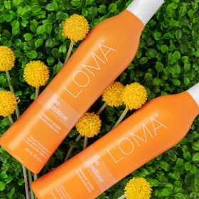 Loma conditioner on bathroom shelf lifestyle shot promoting daily use benefit