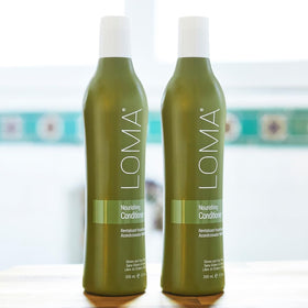 Loma conditioner in bathroom lifestyle displaying product in routine for everyday hydration benefit