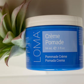Loma crème pomade on styled hair in lifestyle scene adding shine and control