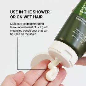 Loma deep conditioner applied to curly hair demonstrating detangling benefit