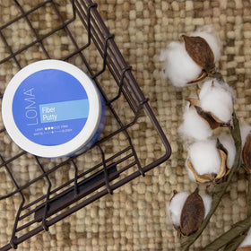 Loma fiber putty lifestyle styling on model creating defined, textured hair