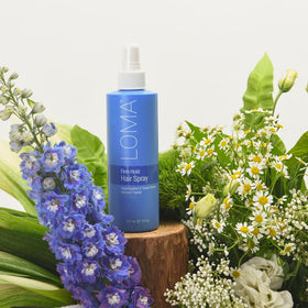 LOMA hairspray used on styled hair demonstrating long‑lasting hold benefit