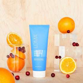 Loma applied during blow-dry creating visible lift and shine